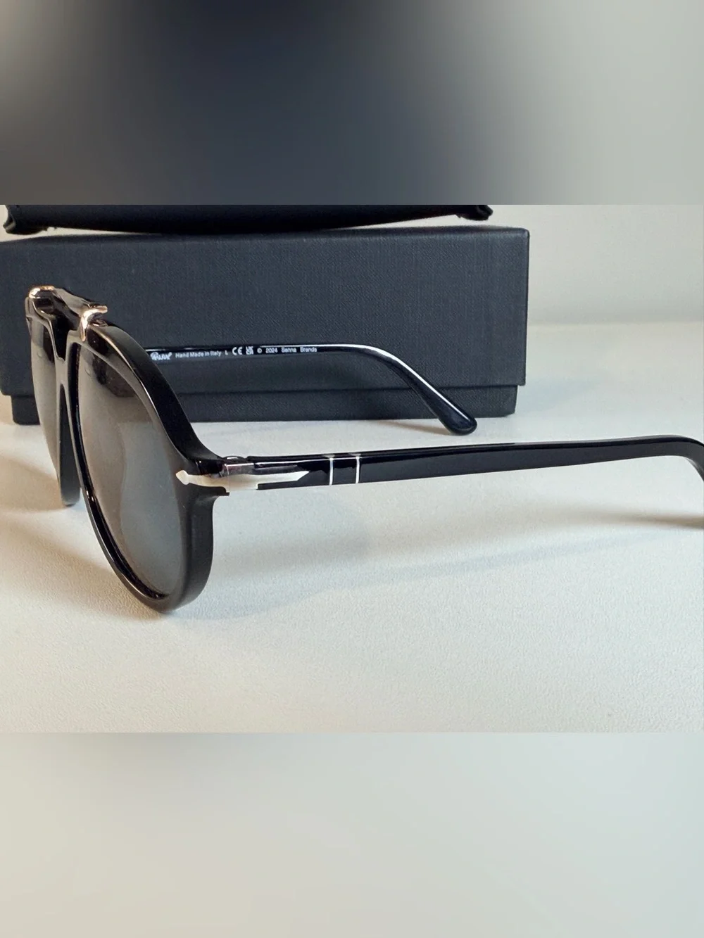 Persol Polarized Sienna Black Sunglasses with Gold Accents and Dark Lenses